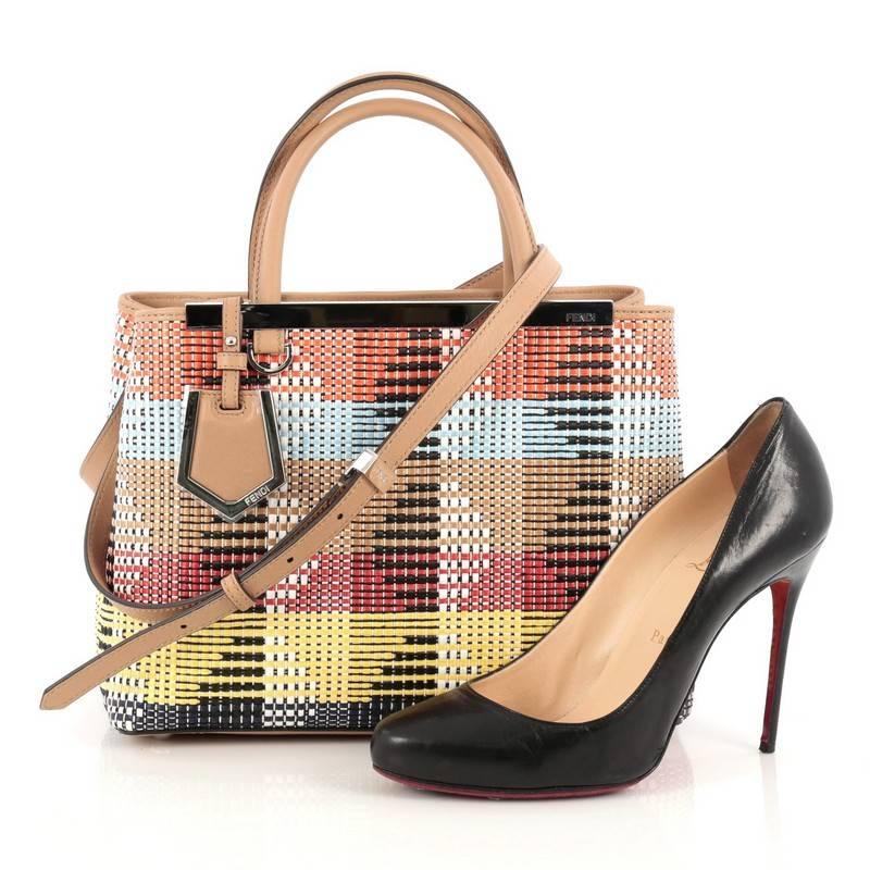This authentic Fendi 2Jours Handbag Woven Raffia Petite presented in Spring 2015 collection is bold and modern in design perfect for fashionistas. Crafted in multicolor woven raffia, this petite bag features dual-flat leather handles, beige leather
