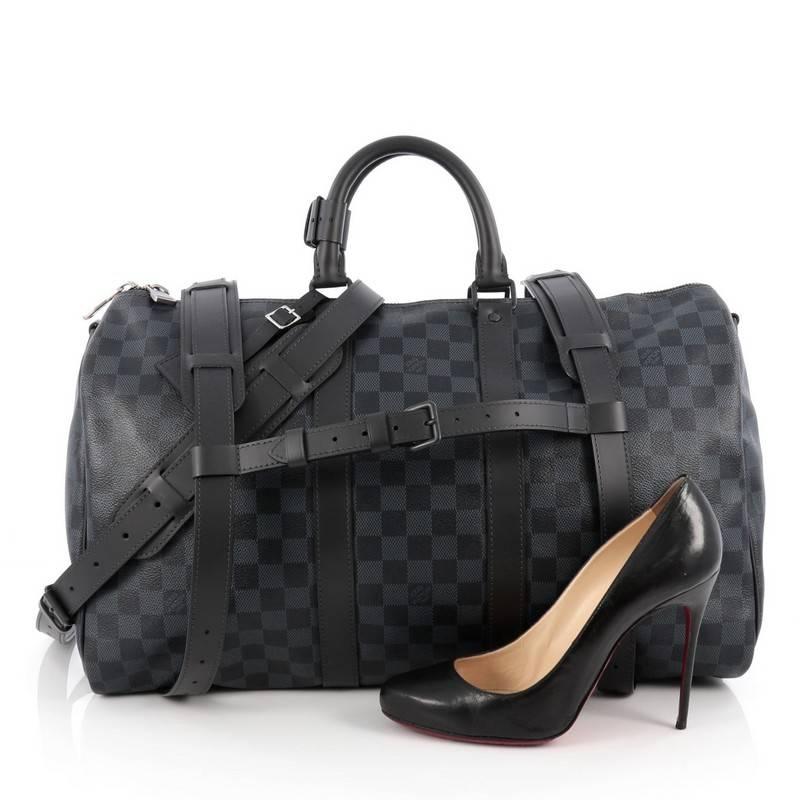 This authentic Louis Vuitton Keepall A Dos Bag Damier Cobalt is the perfect purchase for a weekend trip, and can be effortlessly paired with any outfit from casual to formal. Crafted with classic Louis Vuitton damier cobalt print, this luxurious