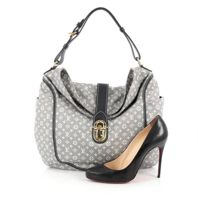 This authentic Louis Vuitton Romance Handbag Monogram Idylle is a statement piece you can surely take from day to night. Crafted with Louis Vuitton’s signature blue monogram idylle, this bag features side slip pockets, an adjustable shoulder strap,