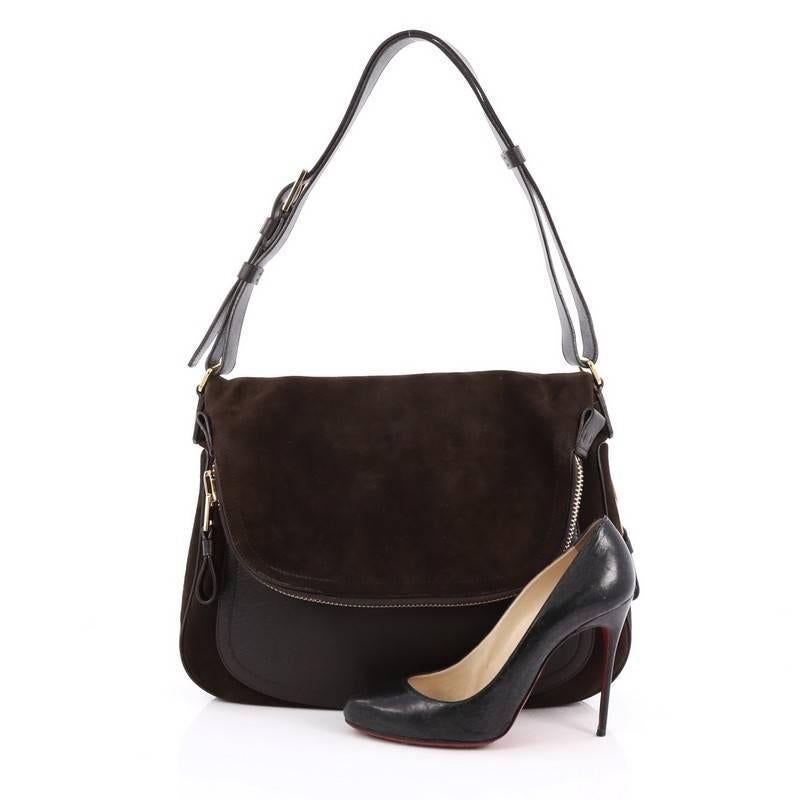 This authentic Tom Ford Jennifer Shoulder Bag Leather and Suede Large redefines modern luxury with timeless elegance. Crafted in dark brown leather and suede, this signature saddle shoulder bag features a single leather strap with zip details,