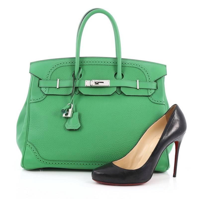 This authentic Hermes Birkin Ghillies Handbag Bamboo Togo and Swift with Palladium Hardware 35 is a special edition piece that graces only a few closets. Crafted from bamboo green leather, this coveted Birkin features dual-rolled handles, frontal