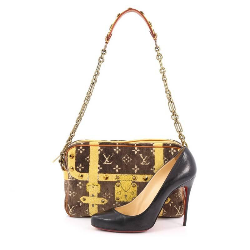 This authentic Louis Vuitton Trompe L'Oeil Trocadero Handbag Monogram Velvet 27 is a limited edition bag first released in 2004 that's a work of art accessory and uses luxurious materials. Crafted from brown monogram velvet, this fabulous bag