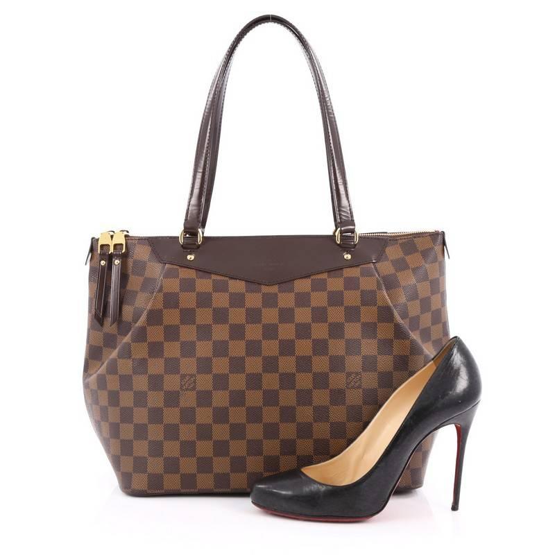 This authentic Louis Vuitton Westminster Handbag Damier GM is sophisticated and elegant in style perfect for everyday use. Crafted in damier ebene coated canvas, this soft, structured tote features distinctive pleats giving it a feminine edge,