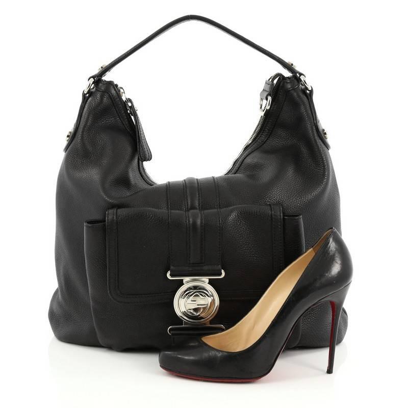 This authentic Gucci G Coin Hobo Leather Medium is a chic and stylish bag perfect for your daily excursions. Crafted from black leather, this gorgeous bag features, flat leather shoulder strap, exterior front flap pocket with silver-tone GG 'coin'
