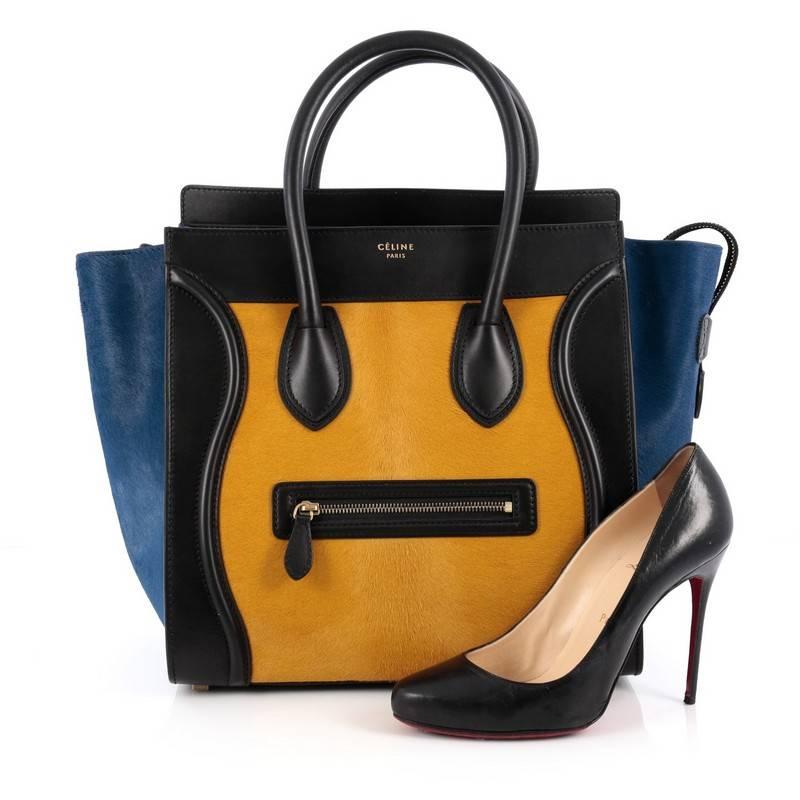 This authentic Celine Tricolor Luggage Handbag Pony Hair and Leather Mini is one of the most sought-after bags beloved by fashionistas. Crafted from genuine tricolor yellow and blue pony hair with black leather, this minimalist tote features