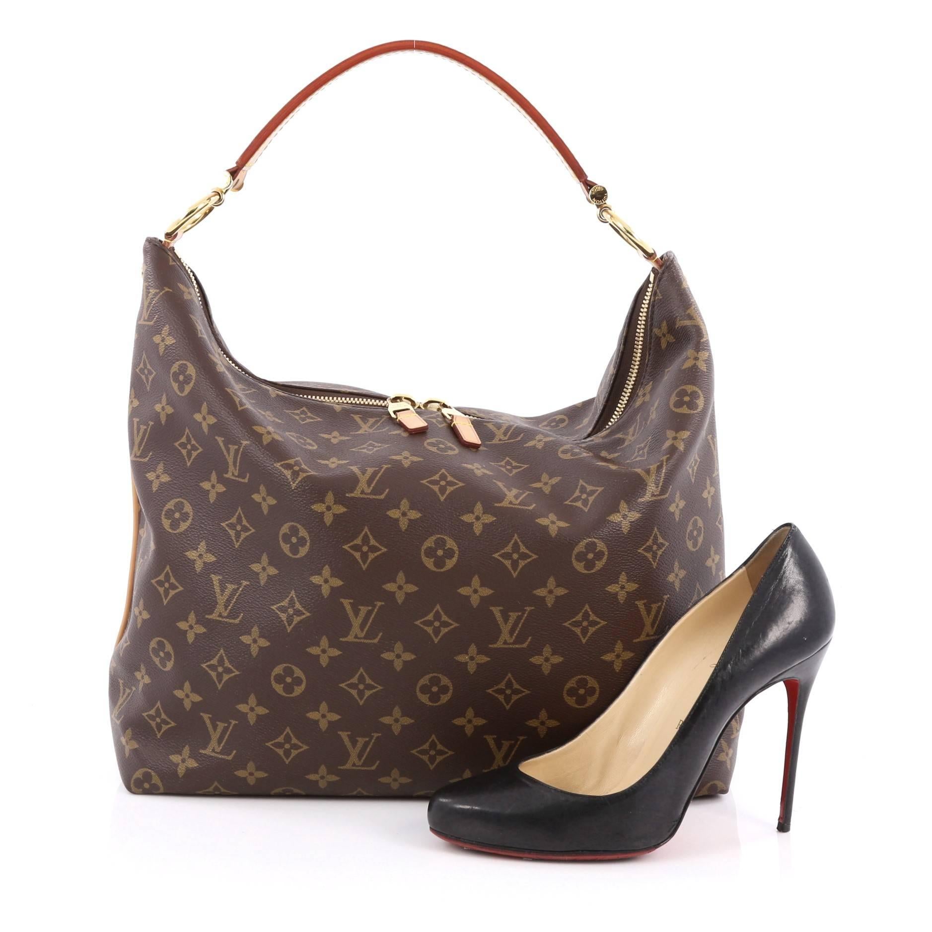 This authentic Louis Vuitton Sully Handbag Monogram Canvas MM mixes luxurious heritage style with a modern flair. Crafted in LV’s brown monogram coated canvas, this vintage-inspired hobo features a modern curved silhouette, thick vachetta cowhide