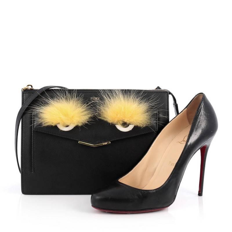 This authentic Fendi Monster Front Pocket Clutch Leather with Fur is a show-stopping must-have accessory for the boldest of fashionistas. Crafted from black leather, this fun and trendy clutch showcases Fendi's popular monster design in genuine