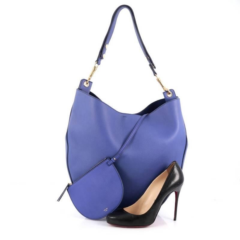 This authentic Celine Hobo Leather Large presented in the brand's Spring/Summer 2015 Collection mixes simple style with luxurious craftsmanship. Crafted from supple, sleek blue leather, this modern hobo features a single, adjustable shoulder strap,
