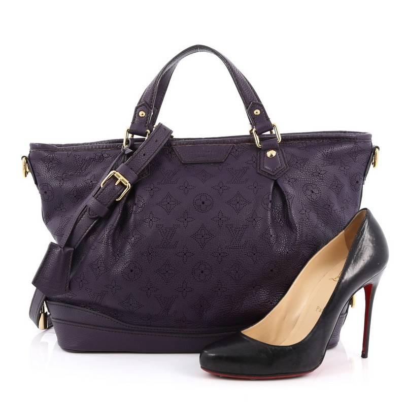 This authentic Louis Vuitton Stellar Handbag Mahina Leather PM displays understated simplicity and elegance with versatile functionality made for the modern woman. Crafted from purple perforated mahina leather, this soft-structured tote features