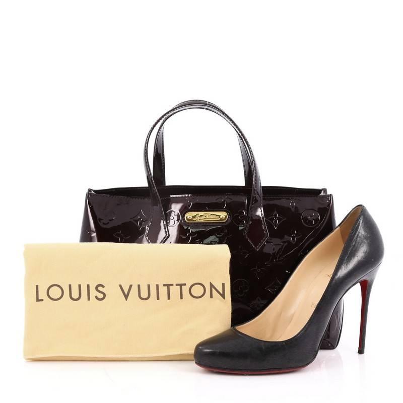 This authentic Louis Vuitton Wilshire Handbag Monogram Vernis PM combines elegance and sophistication ideal for day to day excursions. Crafted in amarante monogram vernis leather, this simple shopper tote features dual-flat handles, a sturdy base