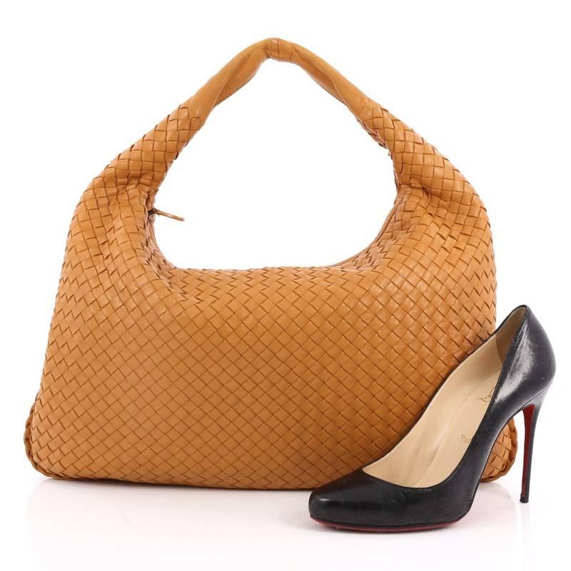 This authentic Bottega Veneta Veneta Hobo Intrecciato Nappa Large is a timelessly elegant bag with a casual silhouette. Excellently crafted from mustard nappa leather woven in Bottega Veneta's signature intrecciato method, this no-fuss hobo features