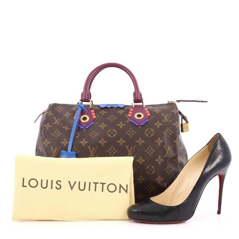 This authentic Louis Vuitton Speedy Handbag Limited Edition Totem Monogram Canvas 30 presented in the brand's Fall/Winter 2015 Collection updates its classic Speedy with playful styling and inspired by Gaston Vuitton's african tribal masks. Crafted