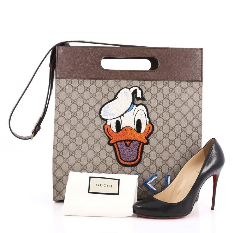This authentic Gucci Donald Duck Soft Tote Embroidered GG Coated Canvas is from the brands Spring Summer 2017 collection designed by Alessandro Michele. Crafted from brown embroidered GG coated canvas, this stylish tote features inset handles,