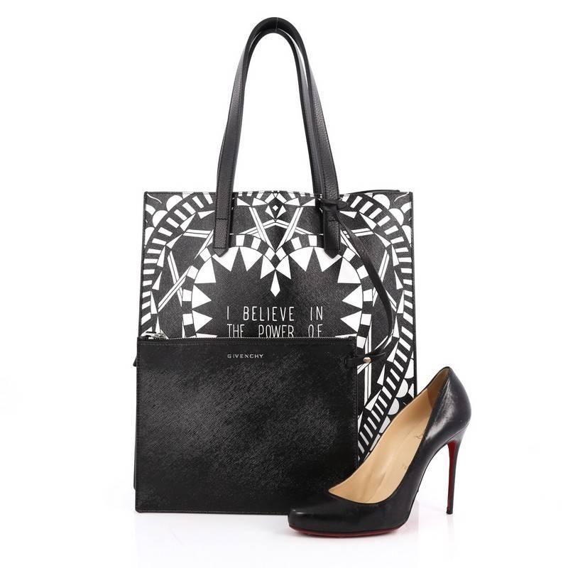 This authentic Givenchy Power of Love Tote Printed Leather Large is a statement chic shopper tote ideal for modern fashionistas. Crafted in black leather, this bag features dual flat leather handles and an abstract black and white print design with