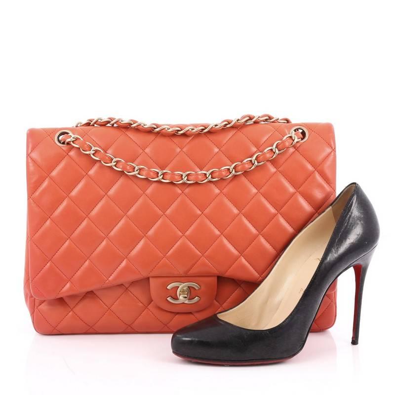 This authentic Chanel Classic Single Flap Bag Quilted Lambskin Maxi is a timeless essential for any modern woman. Crafted in coral quilted lambskin leather, this classic flap features woven-in leather chain strap, exterior back pocket, CC signature