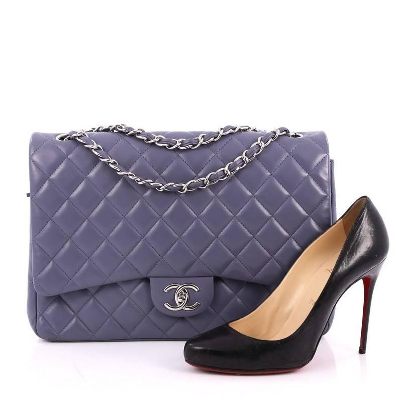 This authentic Chanel Classic Double Flap Bag Quilted Lambskin Maxi exudes a classic yet easy style made for the modern woman. Crafted from periwinkle quilted lambskin leather, this elegant flap features Chanel's signature diamond quilted design,