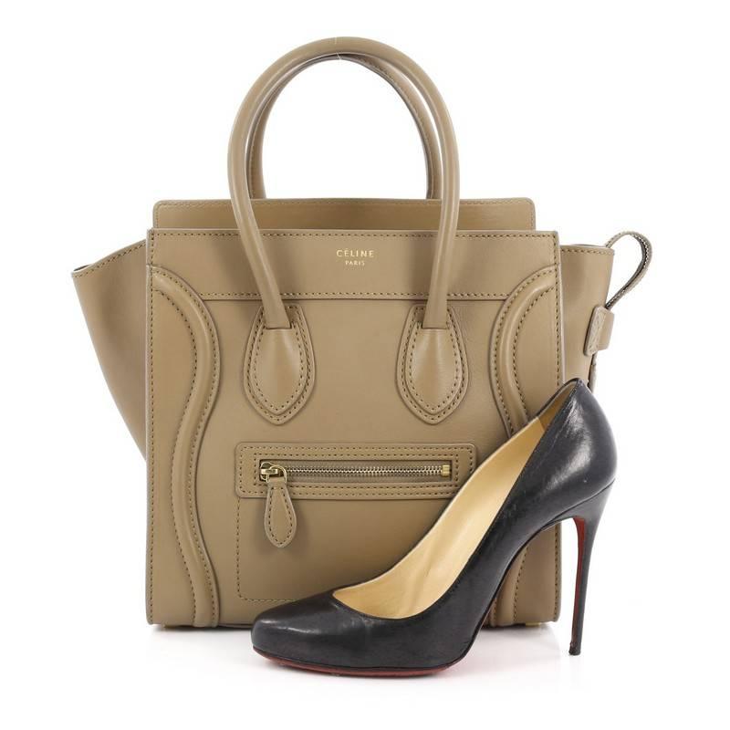 This authentic Celine Luggage Handbag Smooth Leather Micro is the quintessential It bag perfect for the modern woman. Crafted in taupe leather, this popular tote features gold Celine logo detail, dual-rolled leather handles, front zipped pocket,