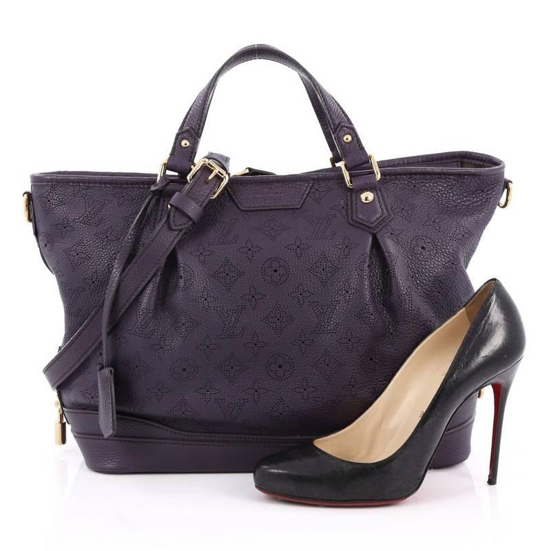 This authentic Louis Vuitton Stellar Handbag Mahina Leather PM displays understated simplicity and elegance with versatile functionality made for the modern woman. Crafted from purple perforated mahina leather, this soft-structured tote features