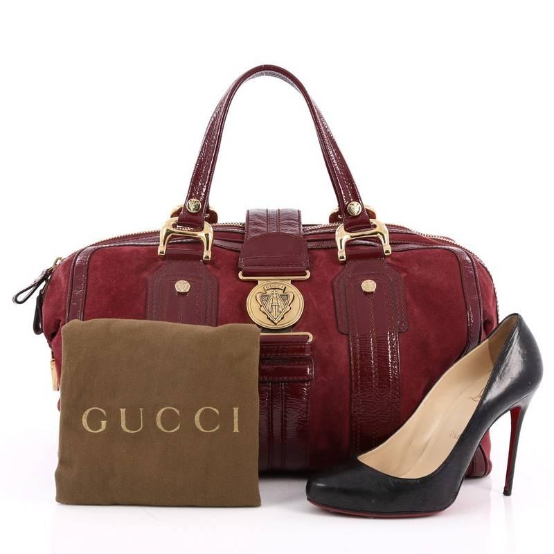 This authentic Gucci Aviatrix Satchel Suede Large combines functional design with vintage style. Crafted in raspberry suede with patent leather trims, this heritage-inspired satchel features dual-flat handles, Gucci's signature crest emblem at its