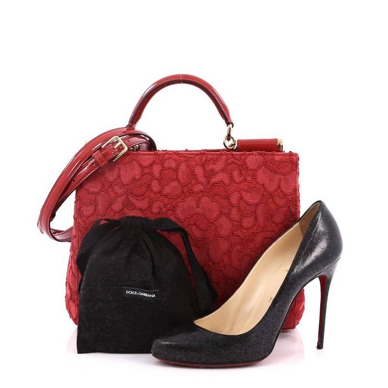 This authentic Dolce & Gabbana Sicily Convertible Shopping Tote Floral Lace Medium is perfect for your daily excursions. Crafted from red floral lace, this chic, structured tote features a single looped patent leather handle with gold link and