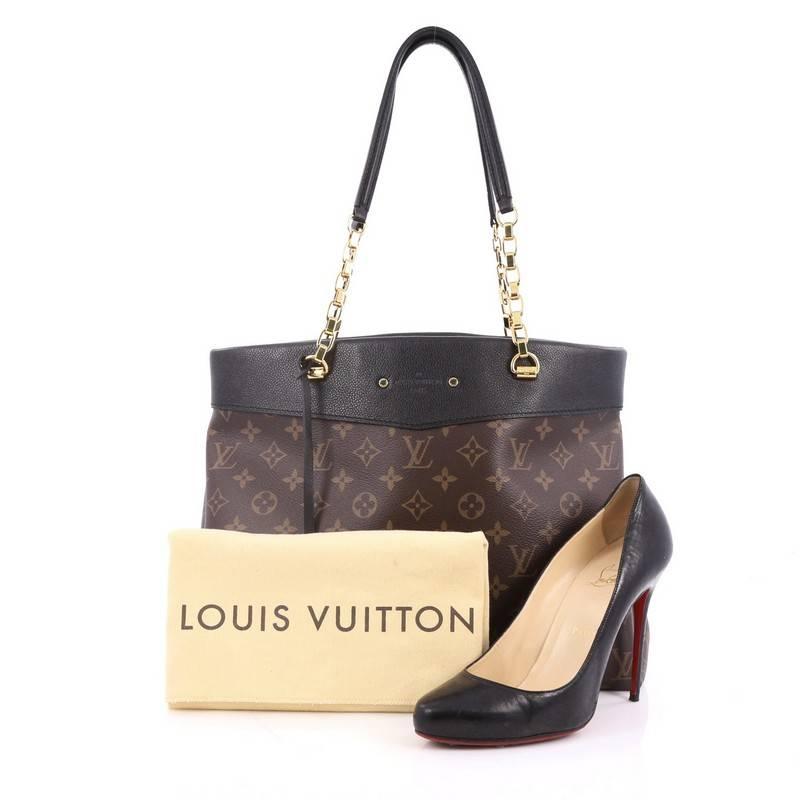 This authentic Louis Vuitton Pallas Shopper Monogram Canvas and Calf Leather from the brand's Pre-Fall 2015 Collection is a luxurious, city tote made for the modern woman. Crafted from brown monogram coated canvas with black calf leather trims, this