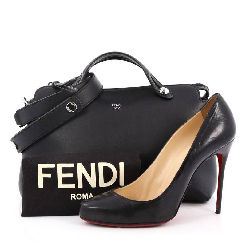 This authentic Fendi By The Way Satchel Calfskin Small, presented in the brand's 2014 Collection, showcases a modern, understated style admired by every fashionista. Constructed from black calfskin leather, this minimalist and functional duffle