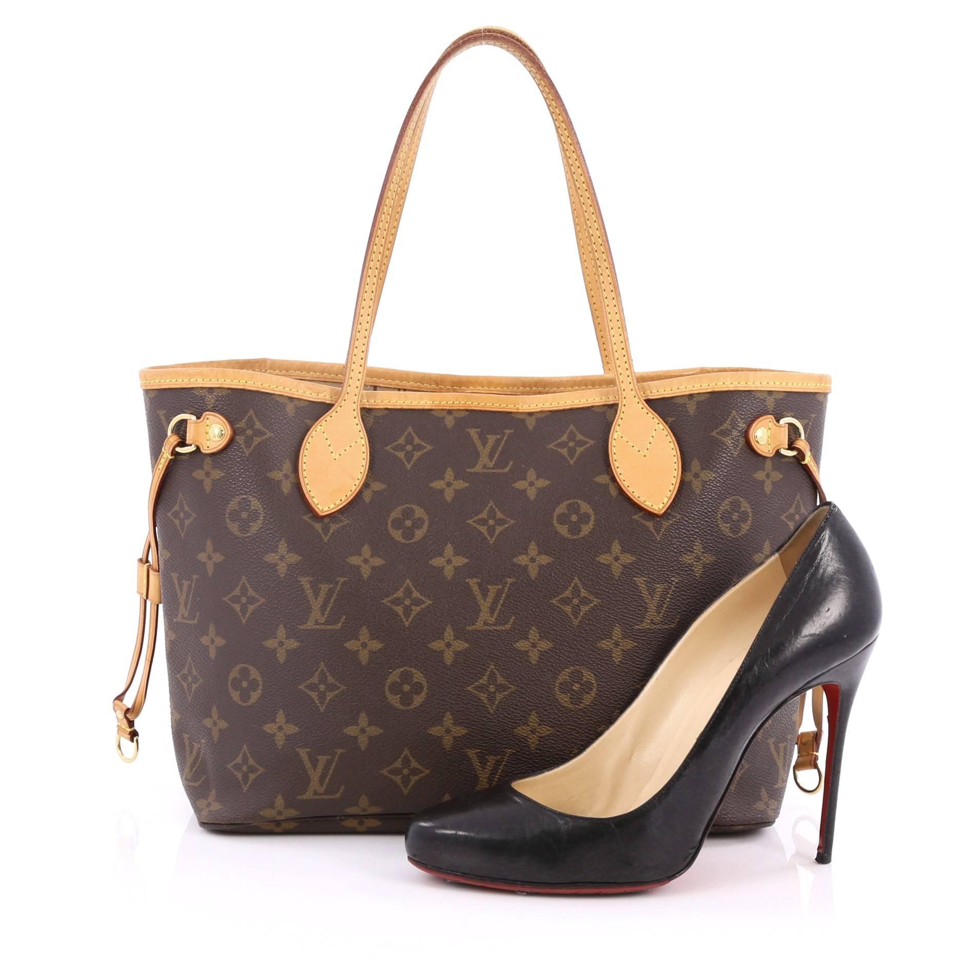 This authentic Louis Vuitton Neverfull Tote Monogram Canvas PM is spacious and structured which makes it a popular and practical tote beloved by many. Constructed from Louis Vuitton's signature brown monogram coated canvas, the tote features natural