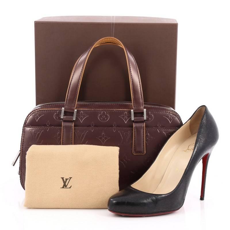 This authentic Louis Vuitton Mat Shelton Handbag Monogram Vernis is made for everyday use. Crafted in matte plum monogram vernis, this bag features dual flat leather handles, exterior front slip pocket, and matte silver-tone hardware accents. Its