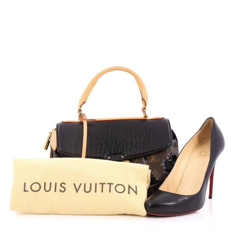 This authentic Louis Vuitton Carrousel Handbag Limited Edition Fleur De Jais presented in the brand's Fall/Winter 2010 Collection is a hard-to-find accessory perfect to add to your collection. Crafted from brown monogram coated canvas, this top