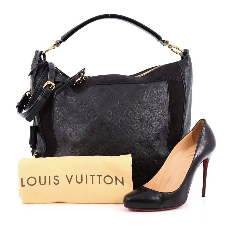 This authentic Louis Vuitton Audacieuse Handbag Monogram Empreinte Leather GM is a stylish and functional must-have for LV lovers. Crafted from a combination of infini navy blue monogram empreinte leather and suede, this glamorous hobo features a