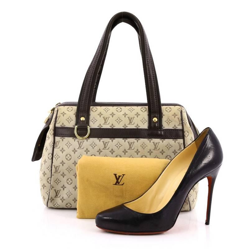 This authentic Louis Vuitton Josephine Handbag Mini Lin PM is sure to add a refreshing, casual look to any ensemble. Crafted in light green monogram mini lin canvas with leather trims, this lightweight petite tote features a structured silhouette,