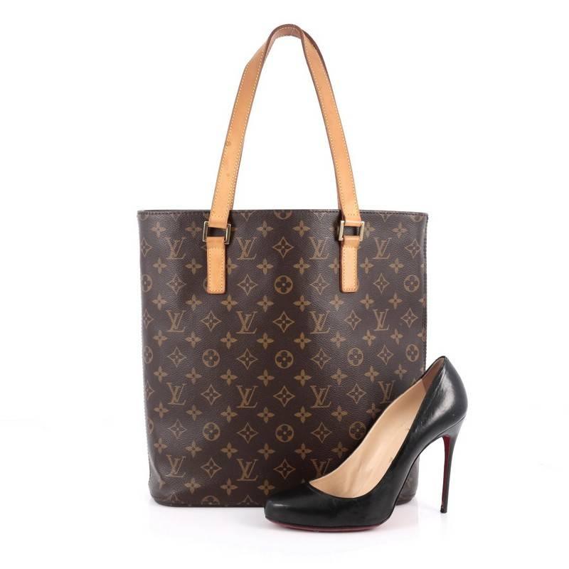 This authentic Louis Vuitton Vavin Handbag Monogram Canvas GM is the largest of all Vavin bags and a perfect every day carryall tote. Constructed with Louis Vuitton's iconic monogram canvas, this bag features dual-flat leather handles, vachetta