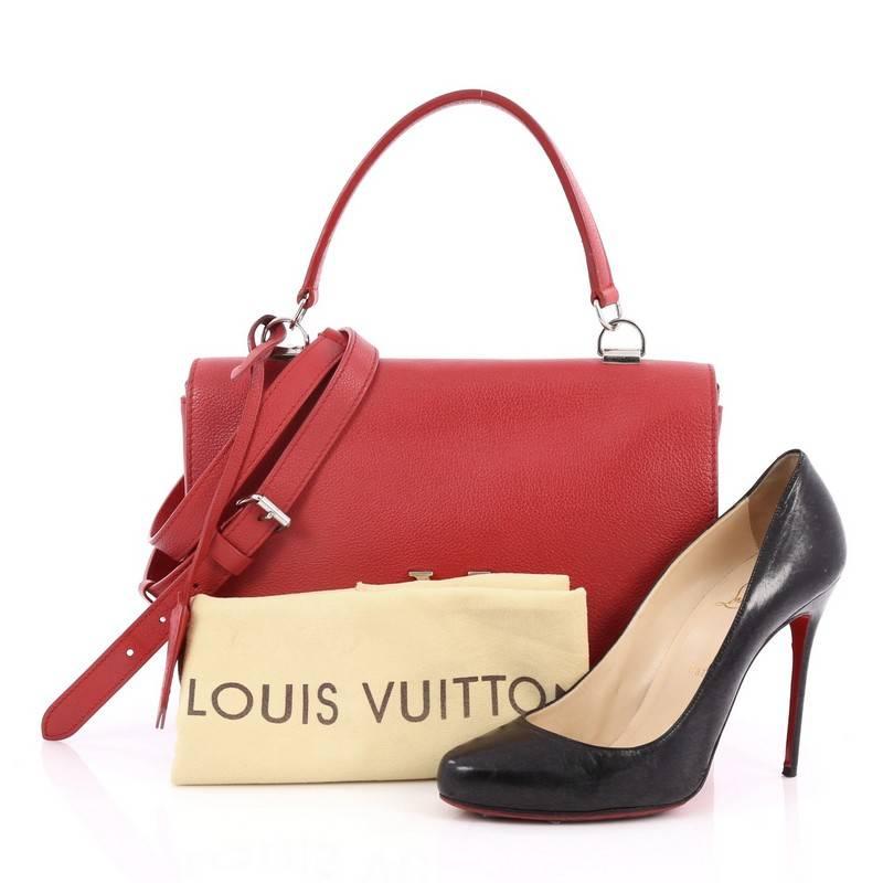 This authentic Louis Vuitton Lockme II Bag Leather presented in the brand's 2015 Collection is a must-have signature, city bag made for the modern woman. Crafted from red leather, this chic bag features an adjustable removable shoulder strap, side
