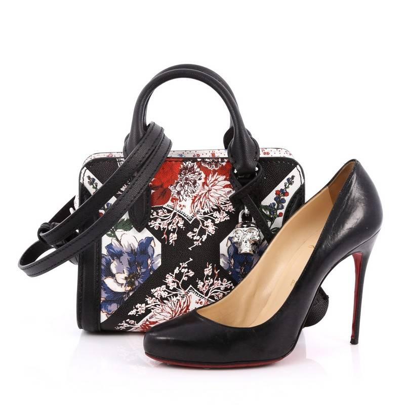 This authentic Alexander McQueen Padlock Zip Around Tote Printed Leather Mini is an edgy and modern accessory made for every fashionista. Crafted from multi color floral printed leather, this functional tote features dual-rolled handles, defined
