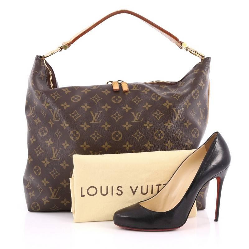 This authentic Louis Vuitton Sully Handbag Monogram Canvas MM mixes luxurious heritage style with a modern flair. Crafted in LV’s brown monogram coated canvas, this vintage-inspired hobo features a modern curved silhouette, thick vachetta cowhide