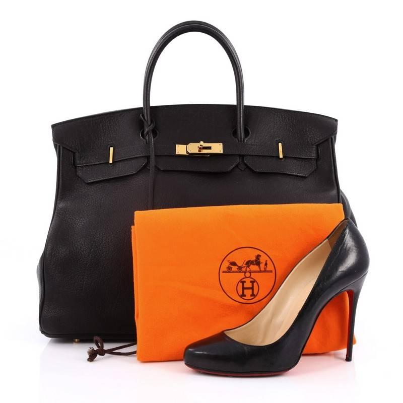 This authentic Hermes Birkin Handbag Black Evergrain with Gold Hardware 40 stands as one of the most-coveted bags fit for any fashionista. Constructed from sturdy, scratch-resistant black evergrain leather, this stand-out oversized tote features