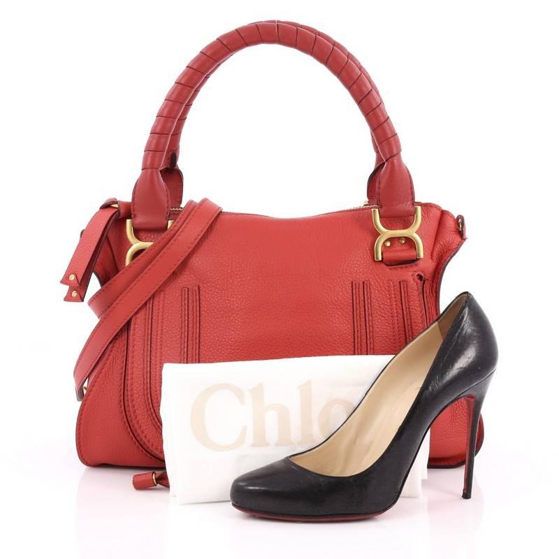 This authentic Chloe Marcie Satchel Leather Medium is perfect for the on-the-go fashionista. Constructed from red leather, this popular satchel features wrapped leather handles, horseshoe stitched front flap, and matte gold-tone hardware. Its top