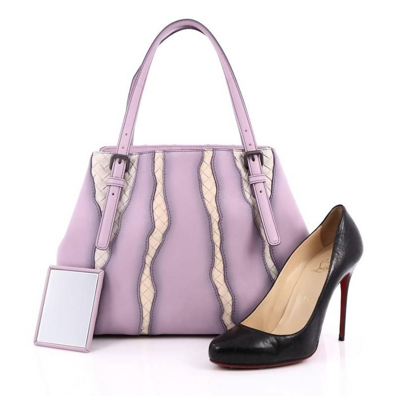 This authentic Bottega Veneta A-Shape Glimmer Tote Washed Nappa Leather with Intrecciato Detail Medium has been given a sophisticated edge by the new Glimmer motif. Crafted from light purple washed nappa leather, this stylish bag features dual