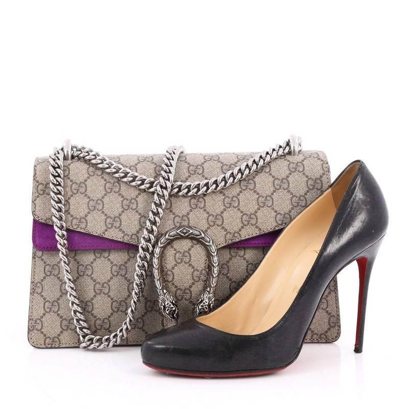 This authentic Gucci Dionysus Handbag GG Coated Canvas Small named after the Greek God is a stunning piece. Crafted from taupe GG coated canvas, this satchel features aged silver chain link strap, textured tiger head spur detail on its flap, purple
