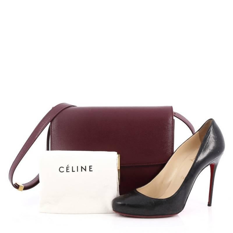 This authentic Celine Box Bag Grainy Leather Medium is a modern reinterpretation to Celine's classic simple box bag. Crafted from plum grainy leather, this sought-after bag features long adjustable strap, stamped Celine logo under its flap and