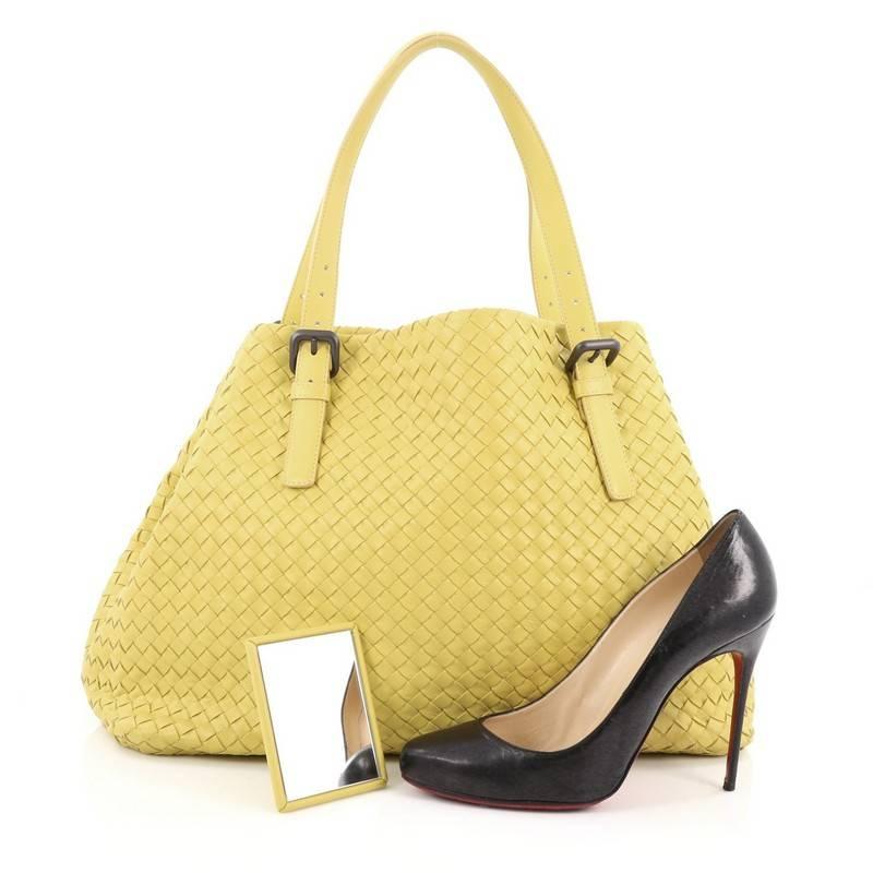This authentic Bottega Veneta A-Shape Tote Intrecciato Nappa Large is a statement piece you can surely take from day to night. Crafted in pale yellow leather woven in Bottega Veneta's signature intrecciato method, this stylish tote features