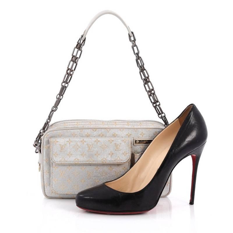 This authentic Louis Vuitton McKenna Shoulder Bag Mini Lin, an elegant and sophisticated limited piece from the brands 2002 Cruise line, is truly desirable. Crafted from the brand's signature grey metallic monogram fabric, this petite bag features