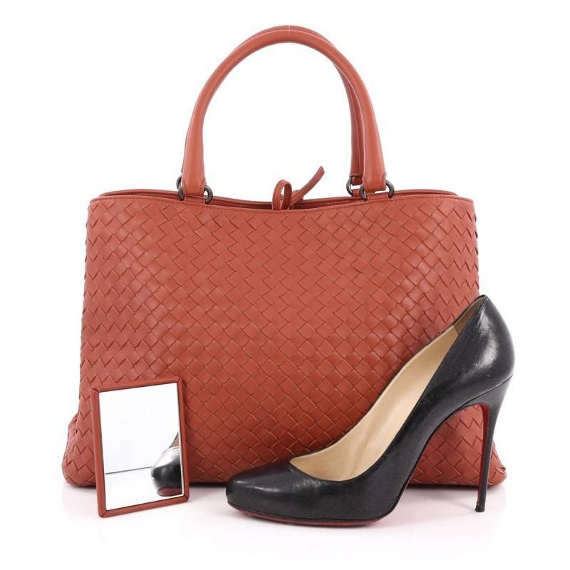 This authentic Bottega Veneta Milano Tote Intrecciato Nappa Large is a timeless, versatile piece you can surely take from day to night. Beautifully crafted in terracota nappa leather in Bottega Veneta's signature intrecciato woven method, this