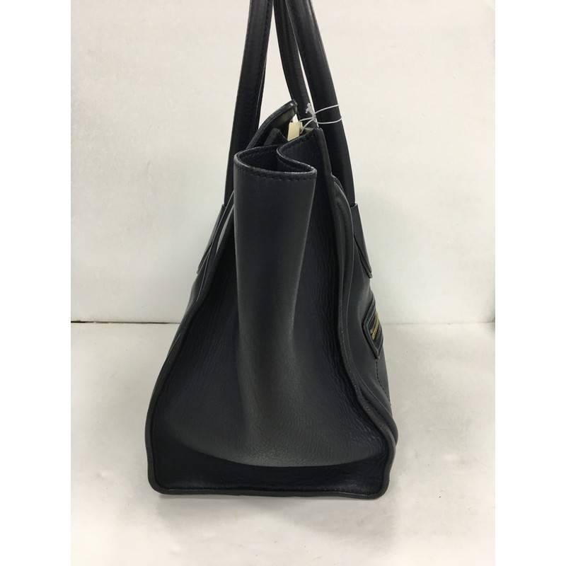 This authentic Celine Luggage Handbag Smooth Leather Mini is the quintessential It bag perfect for the modern woman. Crafted from navy blue smooth leather, this popular tote features dual-rolled leather handles, gold stamped Celine logo detail,