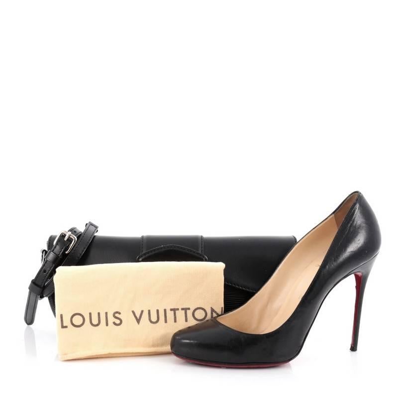 This authentic Louis Vuitton Montaigne Clutch Epi Leather is an exquisite piece that is perfect for day-to-night. Crafted from black epi leather, this clutch features subtle LV logo, adjustable and removable flat leather shoulder strap and