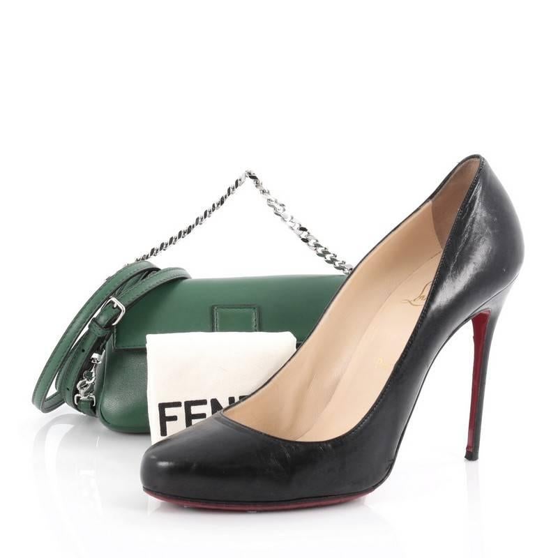 This authentic Fendi Baguette Leather Micro is a show-stopping must-have accessory for the boldest of fashionistas. Crafted from green leather, this fun and trendy bag features adjustable leather strap, silver chain handle, front flap with Fendi