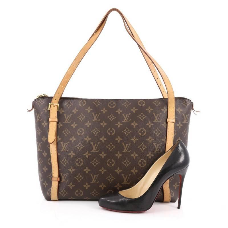 This authentic Louis Vuitton Tuileries Monogram Canvas is classic and sophisticated in design perfect for everyday use. Crafted in iconic monogram canvas, this luxurious city tote features vachetta leather handles and buckle belted trims, protective