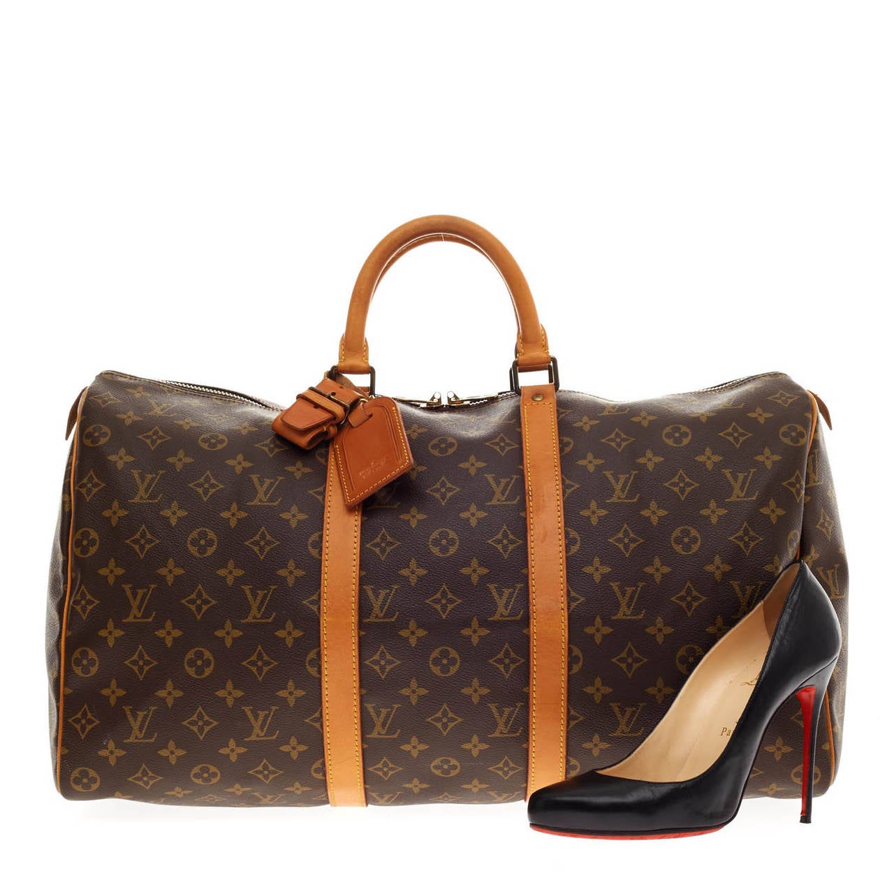 This authentic classic Louis Vuitton Keepall in size 50 features the traditional LV Monogram print beloved by many. This classic travel duffle is the perfect companion for a weekend trip with its ultra-spacious interior, dual-rolled leather handles,