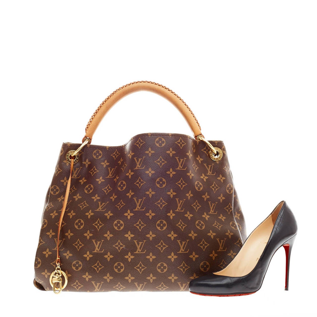 This authentic Louis Vuitton Artsy Monogram Canvas size MM is an elegant and iconic bag that adds a stylish flair to any outfit. Crafted from Louis Vuitton's iconic monogram canvas and featuring a single looped hand-crafted leather handle, this
