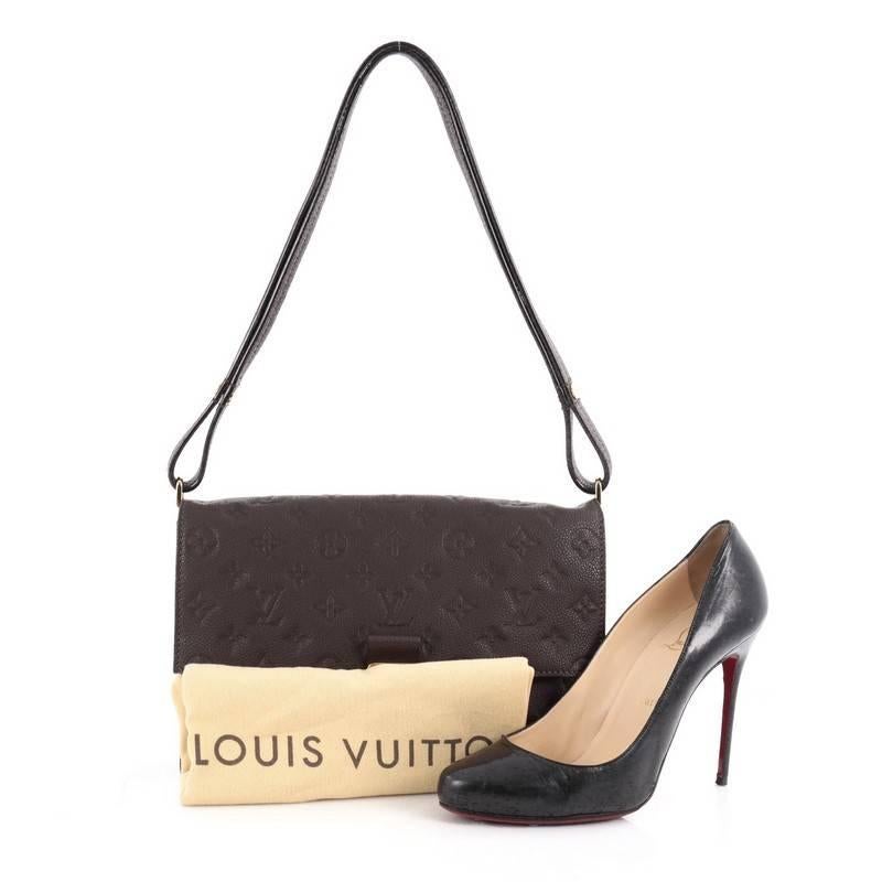 This authentic Louis Vuitton Fascinante Handbag Monogram Empreinte Leather mixes modern design with elegant versatility. Crafted from terre dark brown monogram empreinte leather, this versatile flap bag features an adjustable leather strap that